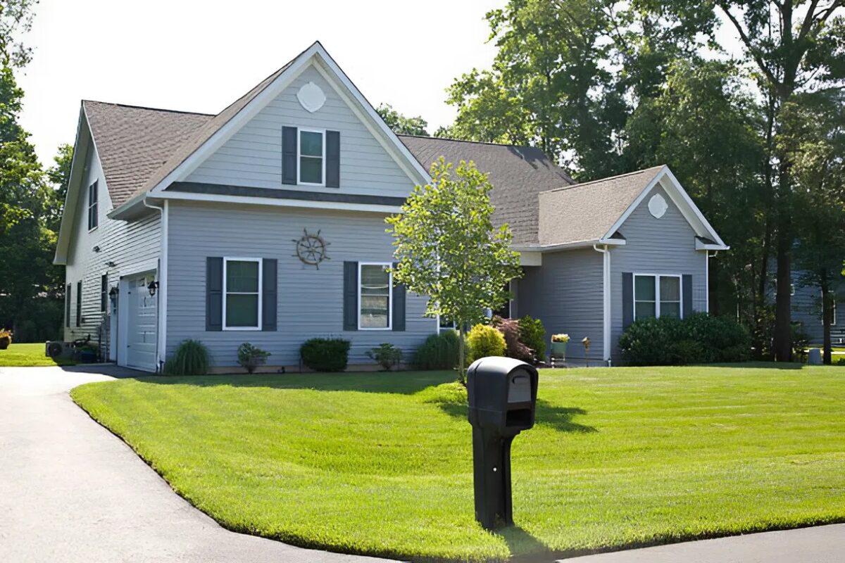 Freshly painted gray home with white trim completed by an exterior painter in Maple Grove, MN