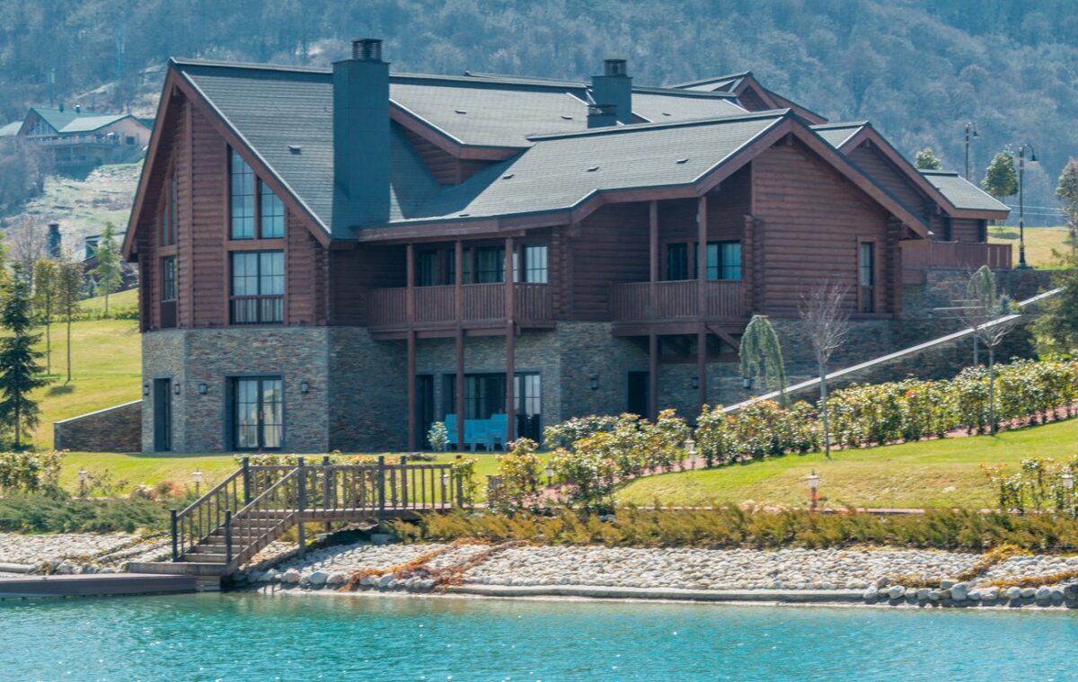 Modern house near water on bright day
