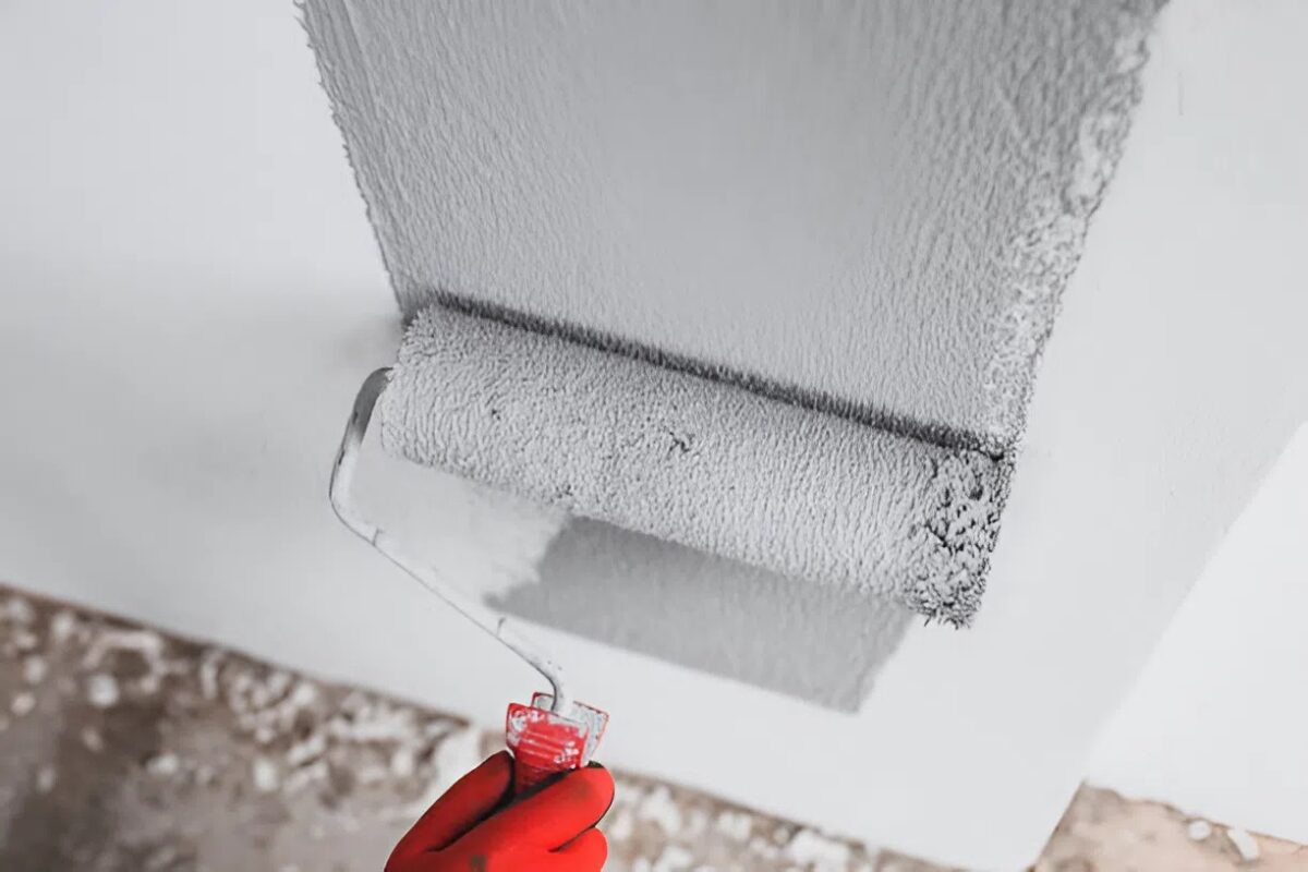 Professional painter applying a fresh coat of paint