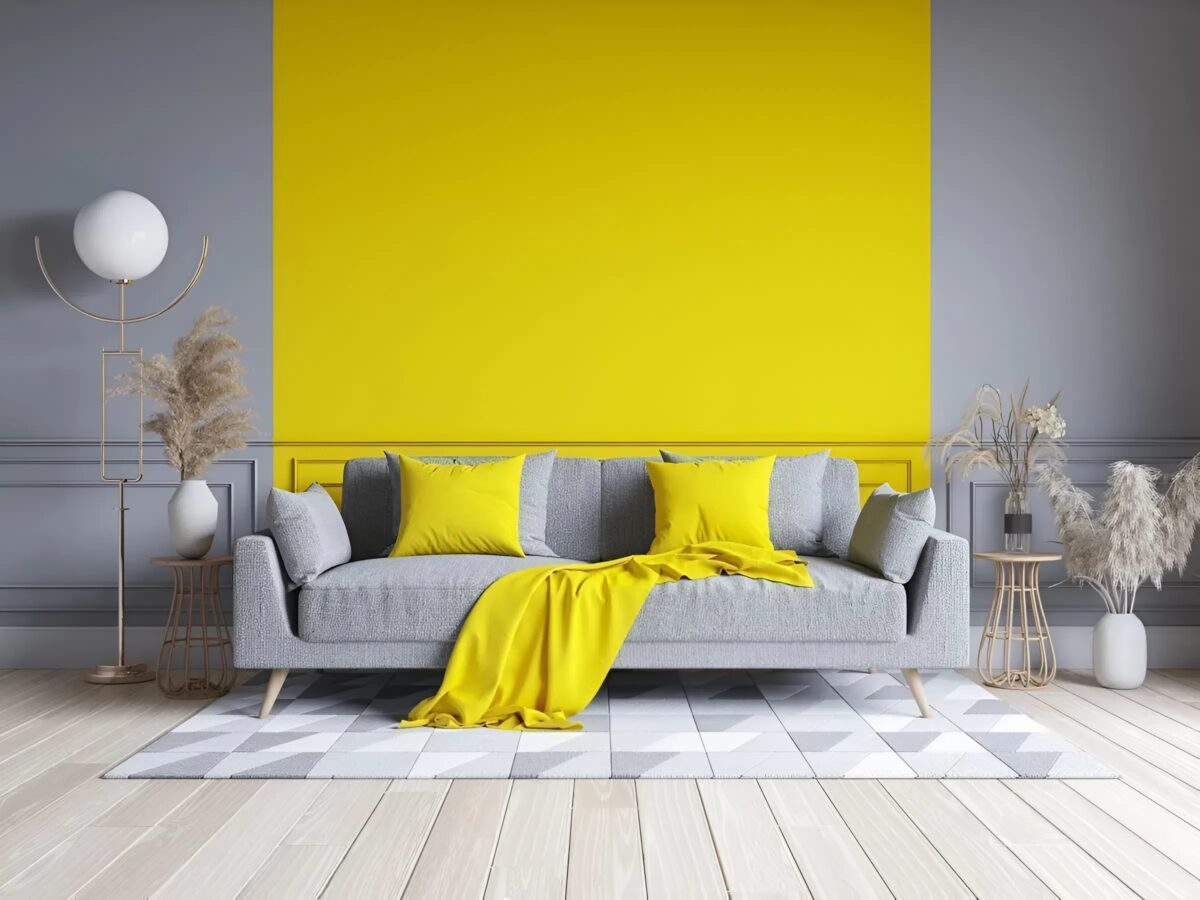 Two-tone living room accent wall featuring yellow and gray