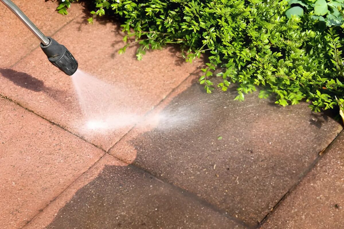 House power washing, removing dirt and stains from concrete pavers