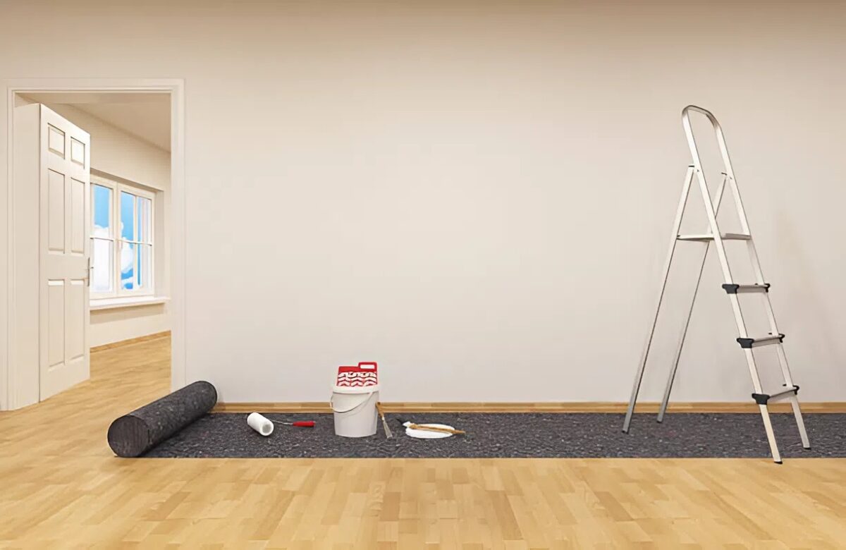 Interior painting prep by a house painter with tools ready