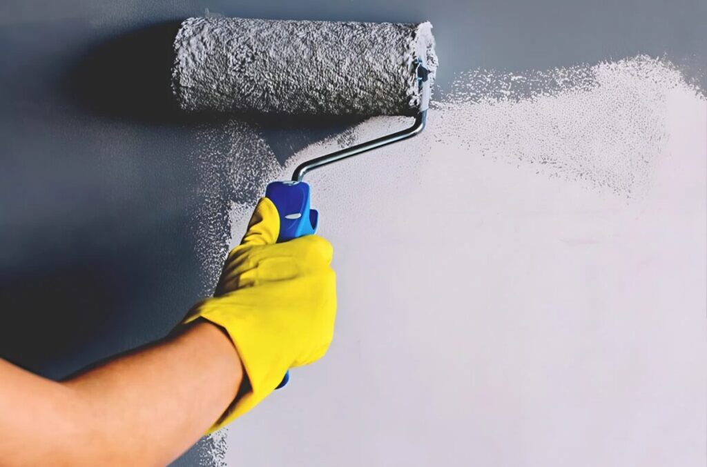 Smooth paint application with roller for even wall coverage by an interior painter in Plymouth, MN