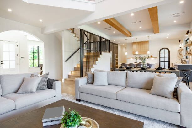 Modern living room with clean white walls, wooden accents, and smooth finishes by a painting company in Big Lake, MN