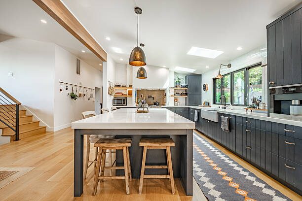 Bright kitchen interior with freshly painted walls in grey, inviting tones, completed by an interior painter in Plymouth, MN.