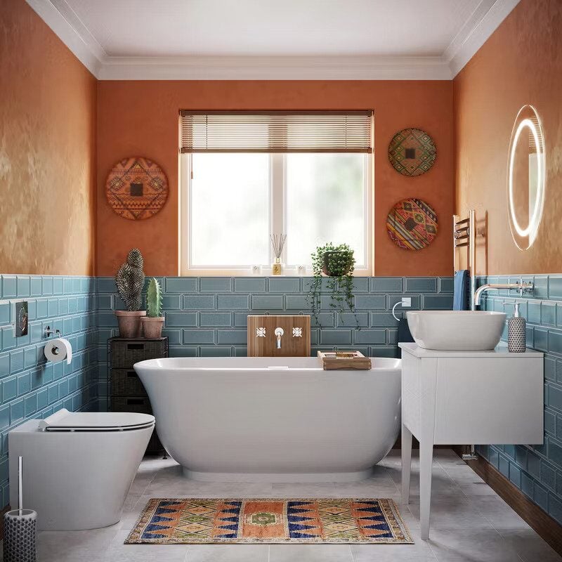 Modern bathroom with warm terracotta wall paint and glossy blue tile accents by an interior Painter in Big Lake, MN