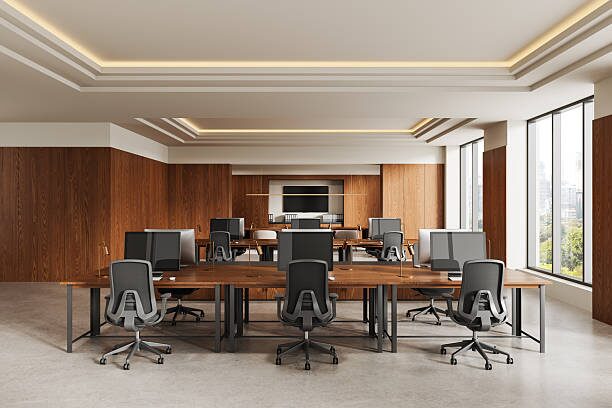 Conference room with wooden walls, crisp white trims, and ceiling details by a painting company in Monticello, MN