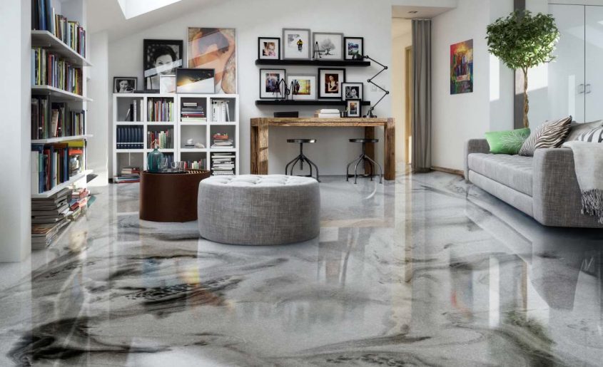 Living room with metallic epoxy concrete flooring, reflective interior finish by a house painter in St. Cloud, MN.