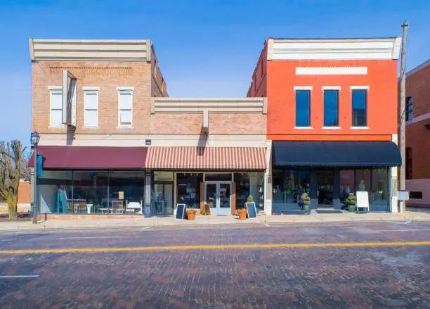 Fresh orange and beige storefront with clean finishes by a painting company in Champlin, MN