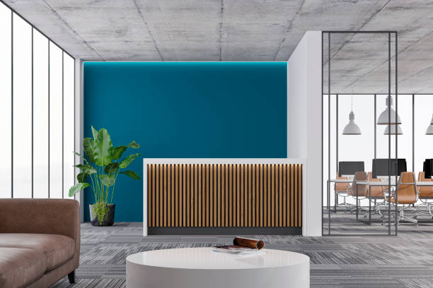 Modern office reception with blue accent wall and grey palette by an interior painter in Maple Grove, MN