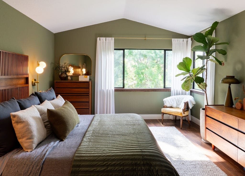 Bedroom with sage green walls and smooth matte paint finish by a house painter in Champlin, MN.
