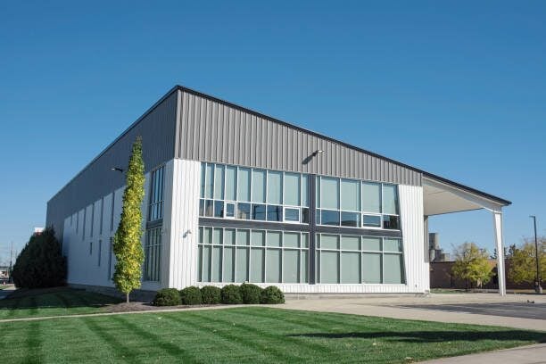 Commercial building with gray metal siding and clean architectural lines by a painting company in Maple Grove, MN.