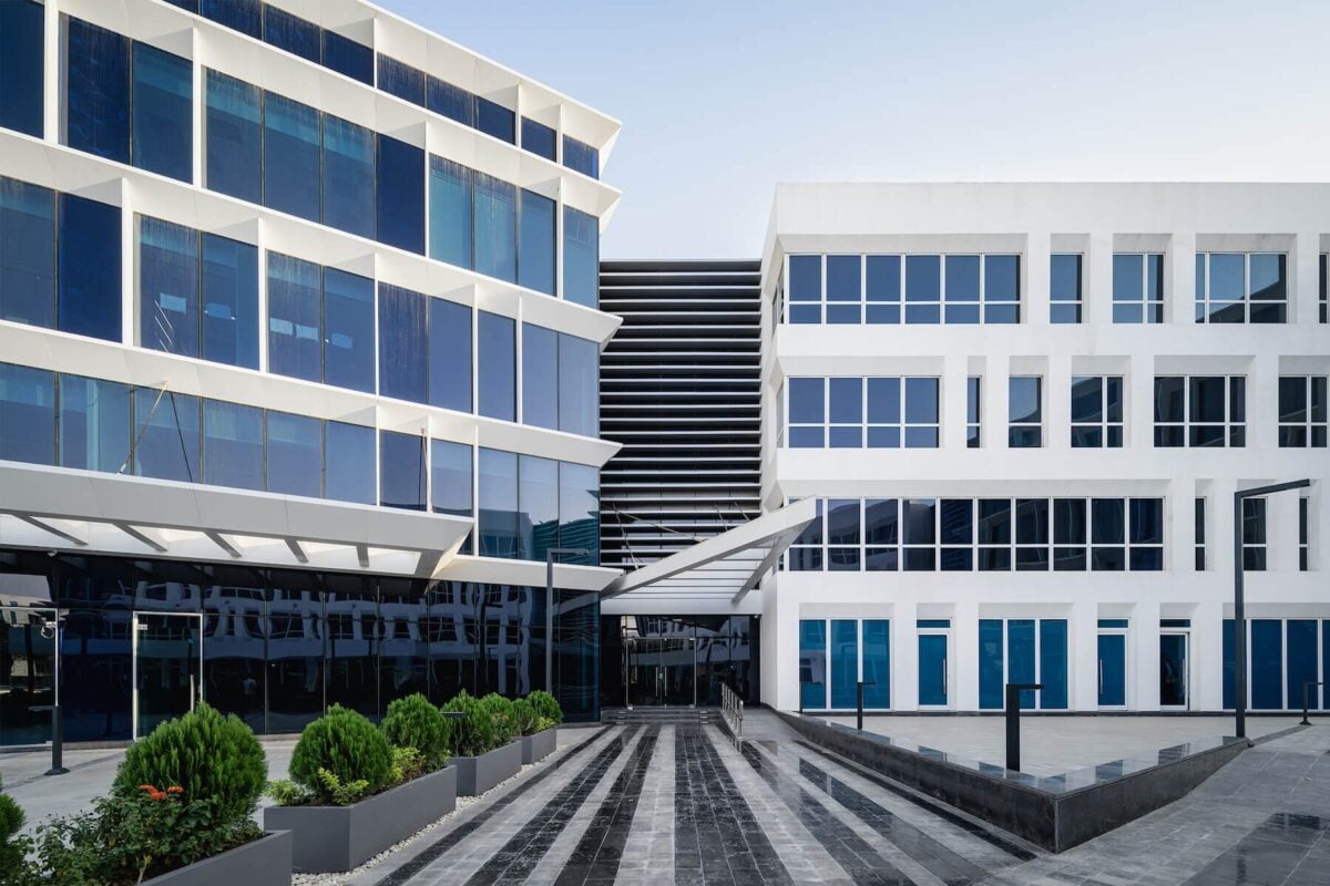 Office building with a clean white exterior and sleek architectural lines by an exterior painter in Elk River, MN.