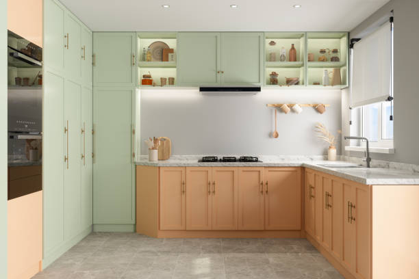 Kitchen with two-tone cabinets featuring soft sage green upper cabinets and warm natural wood-tone lower cabinets by an interior painter in St. Cloud, MN.
